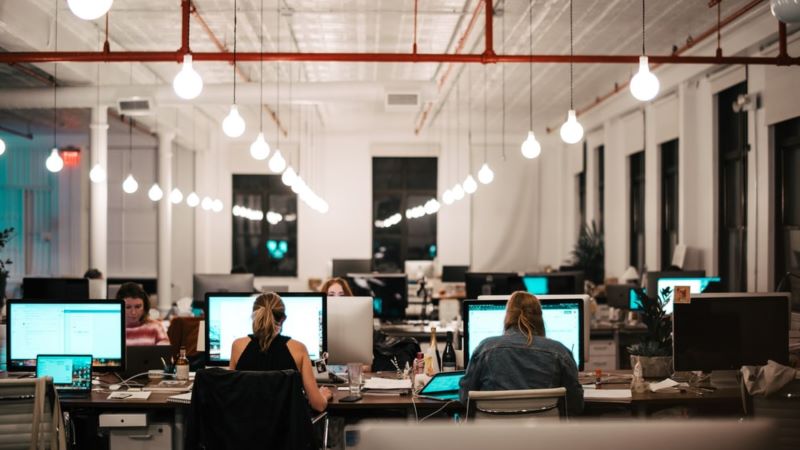 people sitting on chair in front of computer